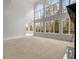 Bright living room featuring two-story windows and natural light at 1483 Jones Rd, Roswell, GA 30075