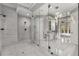 Modern bathroom featuring a glass-enclosed shower and a vanity with dual sinks at 1483 Jones Rd, Roswell, GA 30075