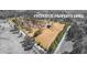 Aerial view of property with yellow property lines, showcasing a large lot with mature trees and a home at 9095 Cedar Grove Rd, Fairburn, GA 30213