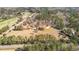 Aerial view of property featuring a mix of cleared and wooded areas at 9095 Cedar Grove Rd, Fairburn, GA 30213
