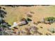 Expansive aerial view of a home featuring a long driveway and surrounded by a sprawling lawn and mature trees at 9095 Cedar Grove Rd, Fairburn, GA 30213