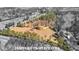 Aerial view of the lot with yellow property lines, featuring a spacious lot, mature trees, and the house at 9095 Cedar Grove Rd, Fairburn, GA 30213