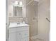 Full bathroom with shower, vanity, and a neutrally tiled shower surround at 9095 Cedar Grove Rd, Fairburn, GA 30213