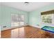 Bedroom featuring hardwood floors and lots of natural light at 9095 Cedar Grove Rd, Fairburn, GA 30213