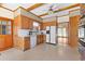 Well-lit kitchen has custom wood cabinets, tile floor, and stainless steel appliances at 9095 Cedar Grove Rd, Fairburn, GA 30213