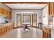 Eat-in kitchen features wood cabinets, tile floors, and a bay window with views of the outdoors at 9095 Cedar Grove Rd, Fairburn, GA 30213