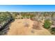 Scenic aerial view showcases the expansive lot with a mix of mature trees, open space, and natural landscape at 9095 Cedar Grove Rd, Fairburn, GA 30213