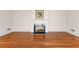 Cozy living room with hardwood floors and classic white fireplace with mantle at 9095 Cedar Grove Rd, Fairburn, GA 30213