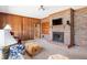 Cozy living room offers wood paneling, brick fireplace, and comfortable seating at 9095 Cedar Grove Rd, Fairburn, GA 30213