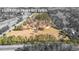 Aerial view of property lines highlighting boundaries of wooded and cleared land at 9095 Cedar Grove Rd, Fairburn, GA 30213
