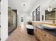 Modern bathroom showcasing double sink vanity, soaking tub, and glass enclosed shower at 942 Fairfield Dr, Marietta, GA 30068