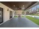 Outdoor patio featuring a fireplace, dark wood ceiling, and white brick columns at 942 Fairfield Dr, Marietta, GA 30068