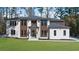 A modern two story home with a well manicured lawn and attractive exterior finishes at 942 Fairfield Dr, Marietta, GA 30068