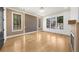 Bright living room features hardwood floors, recessed lighting, and large black framed windows at 942 Fairfield Dr, Marietta, GA 30068