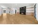 Spacious living room featuring modern fireplace, custom built-ins, and hardwood floors at 942 Fairfield Dr, Marietta, GA 30068