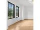 Bright living room featuring hardwood floors and large windows offering ample natural light at 942 Fairfield Dr, Marietta, GA 30068