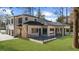 A stunning two-story home with a lush green lawn and an inviting outdoor living space at 942 Fairfield Dr, Marietta, GA 30068