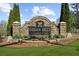 Stone sign for Indian Hills Country Club set amongst manicured landscaping at 942 Fairfield Dr, Marietta, GA 30068