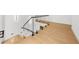 Modern staircase with wood treads and glass railing offers natural light at 942 Fairfield Dr, Marietta, GA 30068