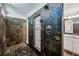 Modern bathroom with a large tile shower featuring three shower heads and stylish glass door at 1145 Verandah Se Ln, Atlanta, GA 30316