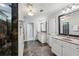 Spacious bathroom featuring double sinks, large mirrors, separate shower, and tile flooring at 1145 Verandah Se Ln, Atlanta, GA 30316