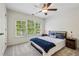 Bright bedroom with a ceiling fan and view of backyard at 1145 Verandah Se Ln, Atlanta, GA 30316