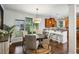 Bright dining area featuring modern lighting, stylish furniture, and adjacent breakfast bar with granite countertop at 1145 Verandah Se Ln, Atlanta, GA 30316