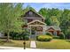 Charming two-story home with craftsman detailing and a beautifully landscaped front yard and inviting front porch at 1145 Verandah Se Ln, Atlanta, GA 30316