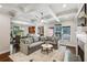 Open living space with coffered ceilings, modern decor, and seamless flow into dining and kitchen areas at 1145 Verandah Se Ln, Atlanta, GA 30316