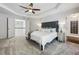 Spacious bedroom featuring a tray ceiling, ceiling fan, with attached Primary bath and hallway access at 1145 Verandah Se Ln, Atlanta, GA 30316