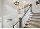 Elegant staircase with carpeted steps, white banister, and dark trim, leading to the upper level at 1145 Verandah Se Ln, Atlanta, GA 30316