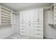 A spacious walk-in closet with ample shelving and drawers at 1145 Verandah Se Ln, Atlanta, GA 30316