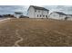 Wide backyard view of a two-story home with white siding and spacious, well-maintained lawn at 14 Ledgemont Way, Acworth, GA 30101