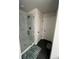 Contemporary bathroom featuring marble-tiled shower and dark, elegant tile flooring at 14 Ledgemont Way, Acworth, GA 30101