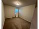 Empty bedroom with carpet, light walls, and a single window at 14 Ledgemont Way, Acworth, GA 30101