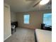 Bedroom with carpet floors, two windows and a ceiling fan at 14 Ledgemont Way, Acworth, GA 30101