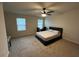 Spacious bedroom with a ceiling fan, two windows, and a bed at 14 Ledgemont Way, Acworth, GA 30101