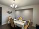 Elegant dining room featuring a modern chandelier, decor art, and lots of room to entertain guests at 14 Ledgemont Way, Acworth, GA 30101