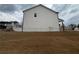 Side view of a two-story home with white siding and a well-maintained lawn at 14 Ledgemont Way, Acworth, GA 30101