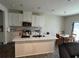 Kitchen area with a large island, stainless steel appliances, quartz countertops, and pendant lighting at 14 Ledgemont Way, Acworth, GA 30101