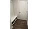 Well-organized mudroom with a built-in bench, storage shelves, and a door for easy access at 14 Ledgemont Way, Acworth, GA 30101