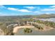 Panoramic aerial view of a sandy beach, marina, and a serene lake, surrounded by verdant trees and clear skies at 24 Allatoona Landing Rd #29, Cartersville, GA 30121