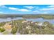 Vast aerial view of a lush, forested area near a lake, highlighting a community with docks and natural surroundings at 24 Allatoona Landing Rd #29, Cartersville, GA 30121
