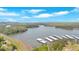 Expansive aerial view of a lake with docks and rolling green hills, showcasing a tranquil waterfront retreat at 24 Allatoona Landing Rd #29, Cartersville, GA 30121