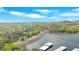 Scenic aerial perspective of a lake surrounded by dense forest and dam, offering a picturesque view of natural beauty at 24 Allatoona Landing Rd #29, Cartersville, GA 30121