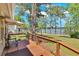 Charming back porch with seating overlooking a well maintained lawn and lake at 24 Allatoona Landing Rd #29, Cartersville, GA 30121