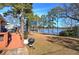 Spacious backyard boasts of lush lawn leading to waterfront pier, perfect for outdoor enjoyment at 24 Allatoona Landing Rd #29, Cartersville, GA 30121