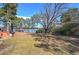Expansive backyard leading to a lake, ideal for outdoor activities and enjoying waterfront views at 24 Allatoona Landing Rd #29, Cartersville, GA 30121