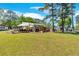 Expansive backyard with an outdoor dining area, grill, and lake views at 24 Allatoona Landing Rd #29, Cartersville, GA 30121