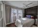 Cozy bedroom featuring a decorative wood accent wall, wood flooring, and a ceiling fan at 24 Allatoona Landing Rd #29, Cartersville, GA 30121